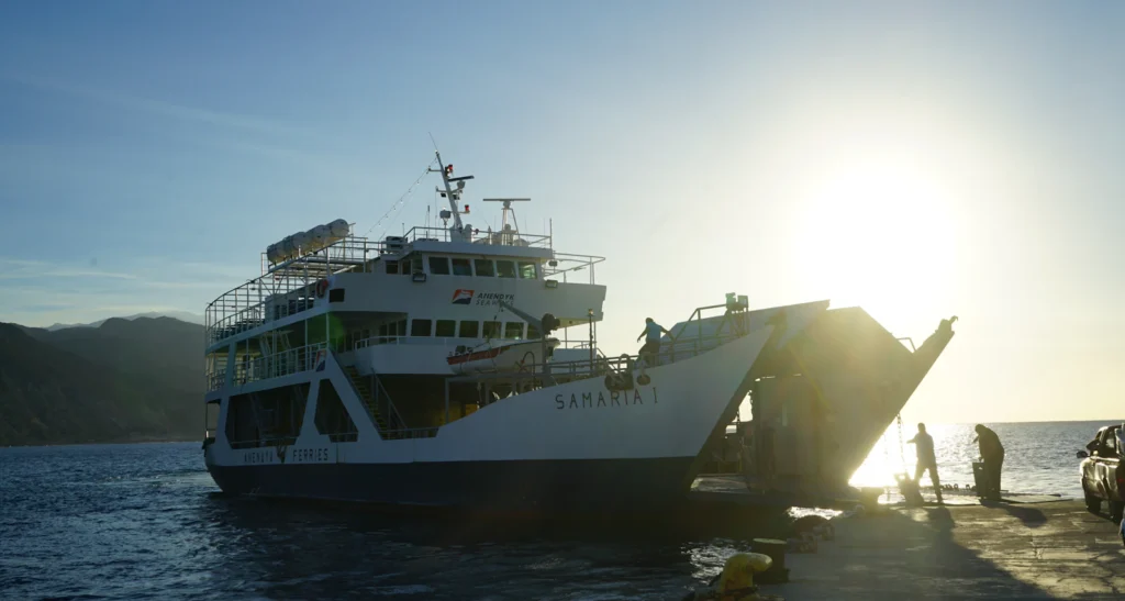 Ferry with boarding ramp open at a Greek port