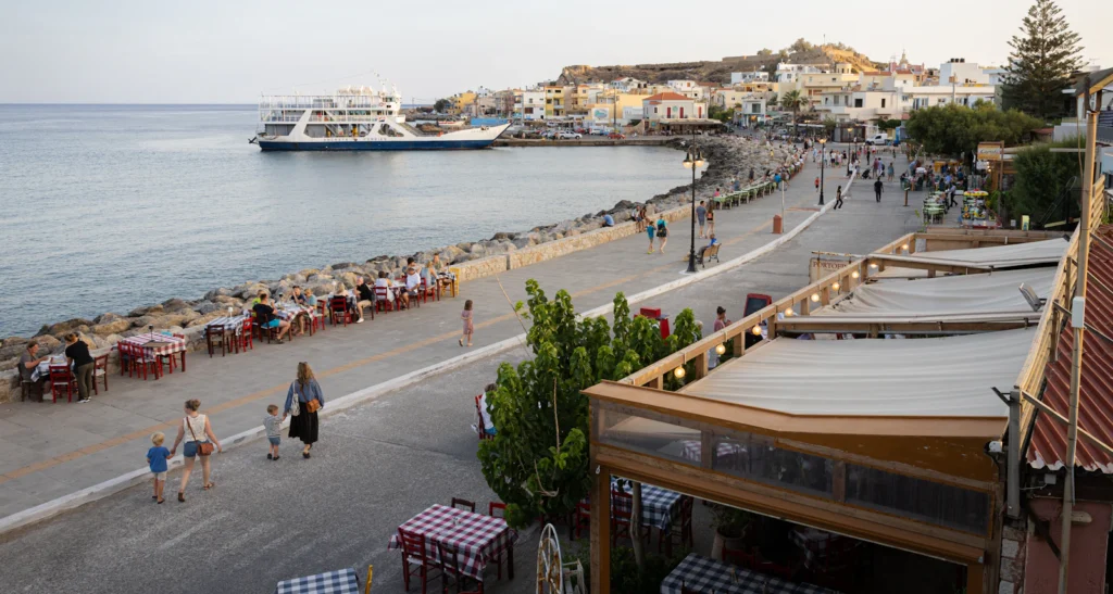Greek island harbour with a ferry arriving for island hopping