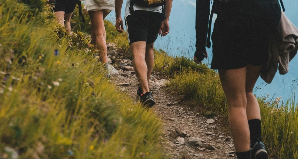 Much Better Adventures: small group of hikers heading into the mountains