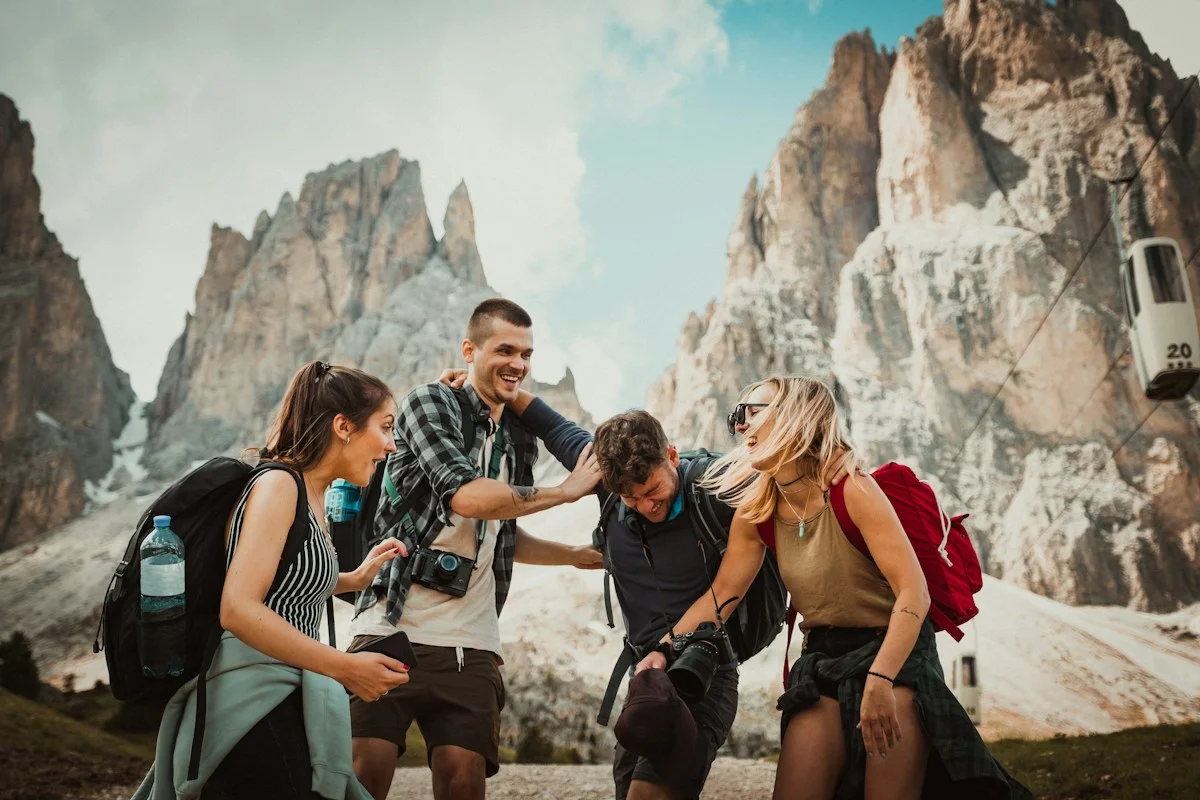 Small group of hikers with a local guide on a rocky mountain trail