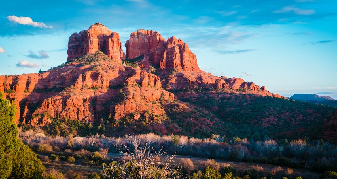 Red sandstone buttes in Sedona, Arizona under a bright blue sky