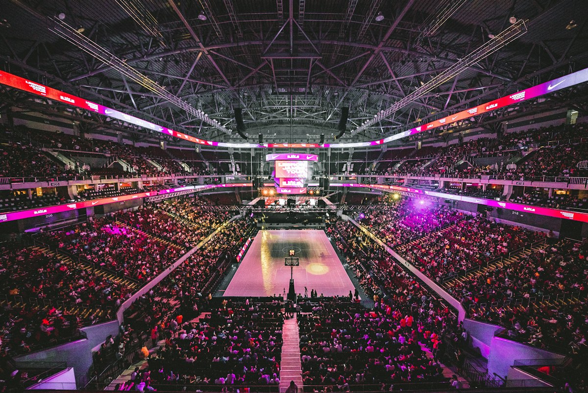 Packed indoor arena during a live event, the kind of sold-out show people buy resale tickets for